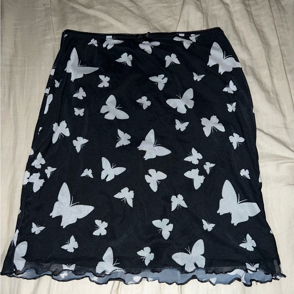 Black skirt with white butterflies and a lace bow
